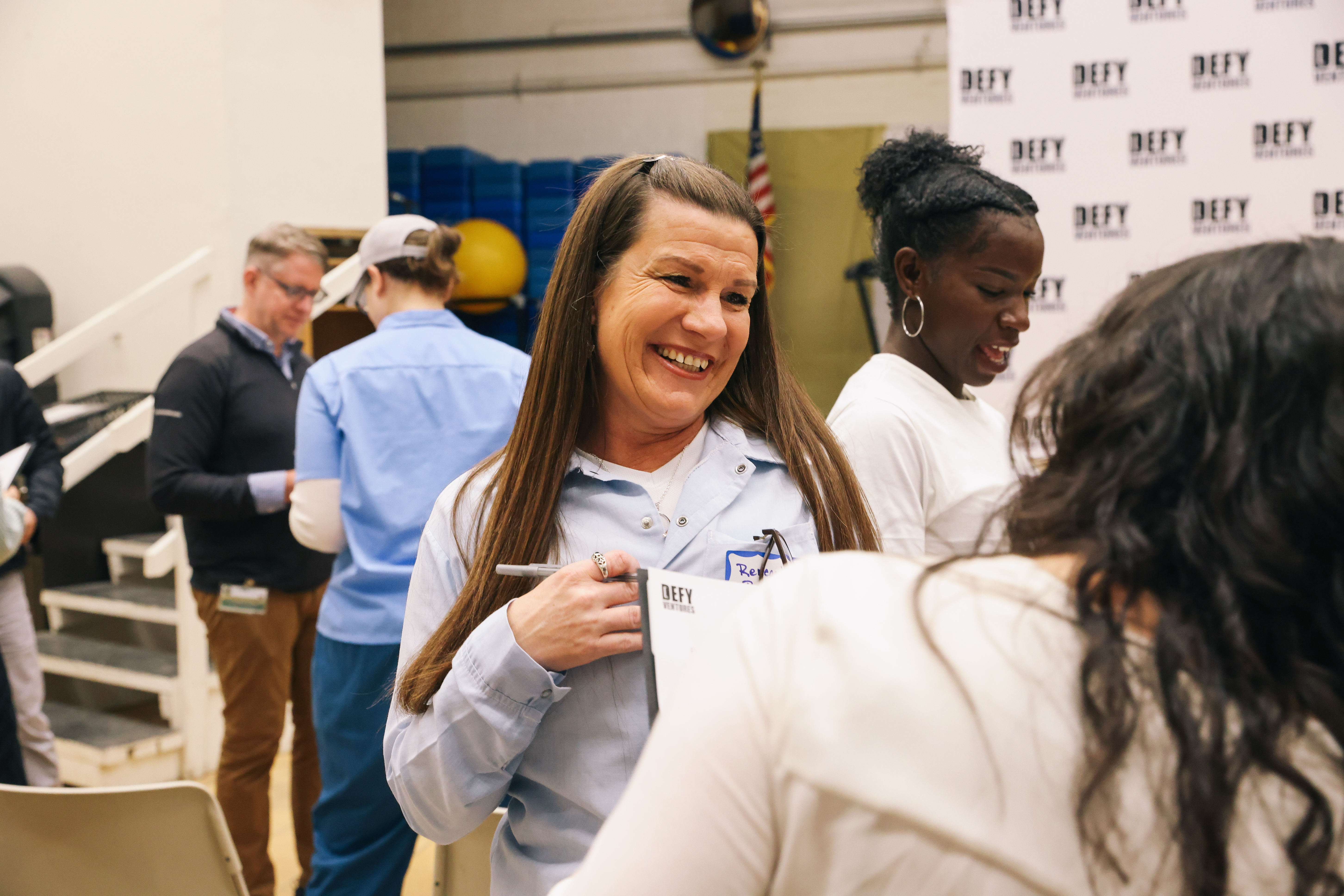 Volunteer and Rayne in an ice-breaker activity